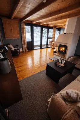 a living room with a couch and a fireplace at 6 Bed traditional mountain cabin in Geilo - close to skiing and hiking in Hol