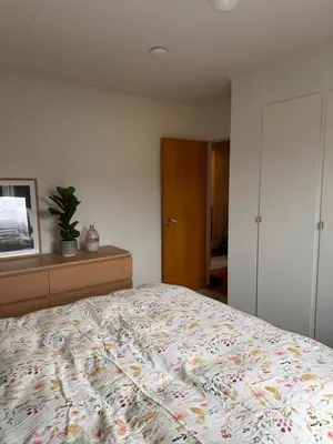 a bedroom with a bed and a dresser at Perfect family house in Voss in Vossevangen