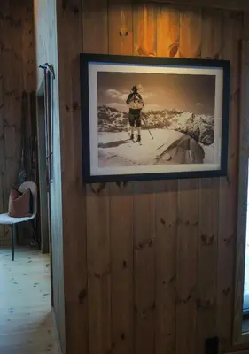 a picture on a wall with a picture of a skier at Cabin With Sauna And Views Over Hallingdal in Flå