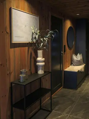 a vase with flowers on a table in a room at Cabin With Sauna And Views Over Hallingdal in Flå