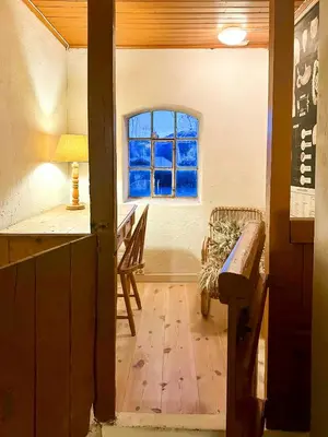 a room with a window and a wooden floor at Charming Farmhouse From 1919 Near Kristiansund in Kristiansund