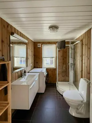 a bathroom with a tub and a sink and a toilet at Cabin Near Ski Trails In Tempelseter in Eggedal