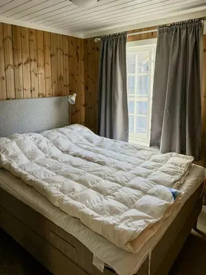 a large bed in a bedroom with a window at Cabin Near Ski Trails In Tempelseter in Eggedal
