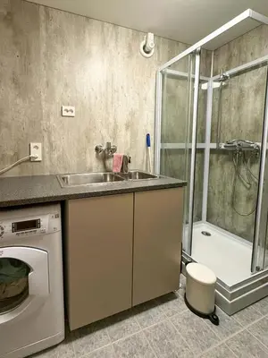 a bathroom with a sink and a shower at Seafront House From 1952 With Views In Veivåg in Bekkjarvik
