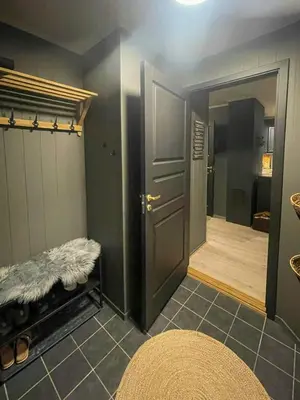 a room with a bathroom with a door and a mirror at Apartment With Ski Inout In Fageråsen Trysil in Trysil