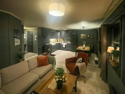 a living room with a couch and a table at Apartment With Ski Inout In Fageråsen Trysil in Trysil