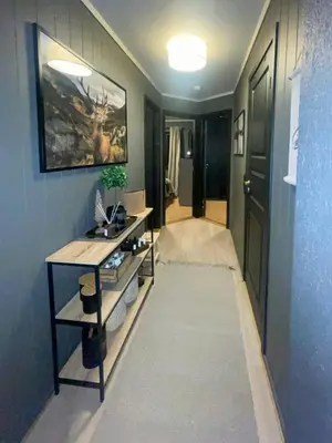 a room with a hallway with a table and a painting at Apartment With Ski Inout In Fageråsen Trysil in Trysil