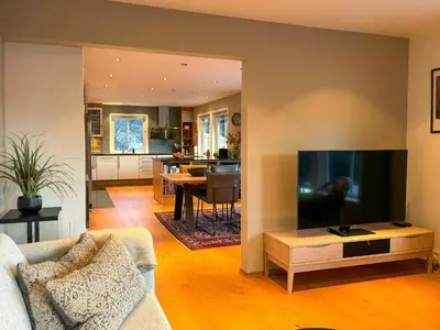 a living room with a couch and a flat screen tv at House With 90 Metres Private Beach On Bømlo in Ervik