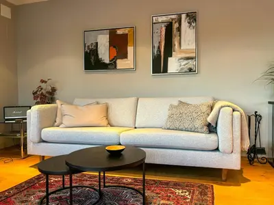 a living room with a couch and a table at House With 90 Metres Private Beach On Bømlo in Ervik