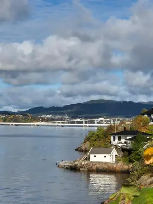 a large body of water with a bridge in the background at Salhusvegen in Bergen