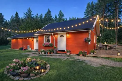 a small house with lights on top of it at Grandma Guest House, Rena Near Ski, Biking, River summer camp in Åmot