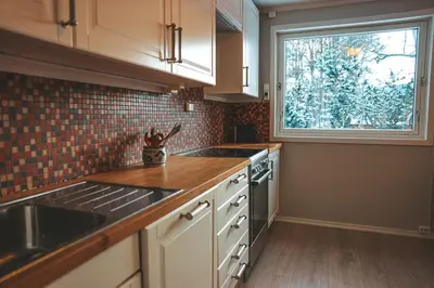 a kitchen with a sink and a window in it at Close to cross-country skiing, slalom slope and mountains - Soltun Geilo in Hol