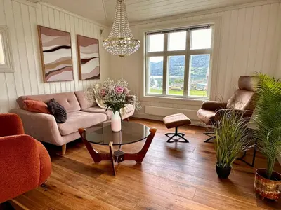 a living room with a couch and a table at Winter paradise Norefjell in Surteberg
