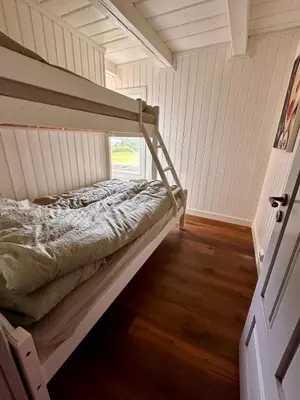 a bedroom with a bunk bed in a room at Winter paradise Norefjell in Surteberg