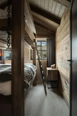 a bedroom with two bunk beds and a ladder at Designer Cabin For 16 With Spa In Turufjell in Flå