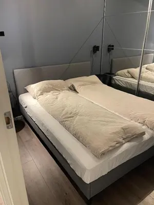 a bedroom with two beds in a room at Modern apartment - Balcony, Parking, BBQ in Vossevangen