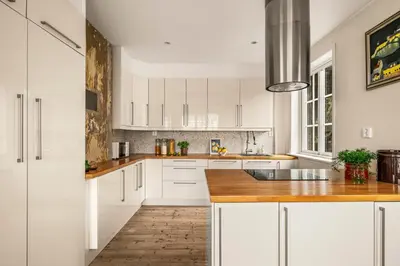 a kitchen with white cabinets and a wooden counter top at A Dream Home with Spectacular Views - NEW! in Bergen