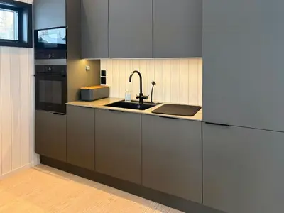 a kitchen with a sink and a counter top at Architect Cabin With Ski-In Near Trysil in Trysil
