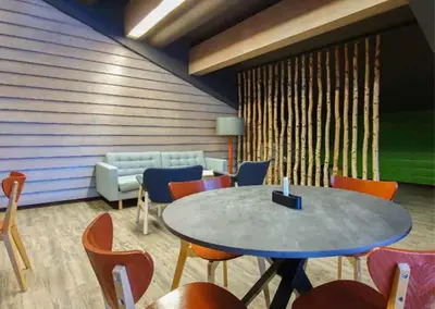 a meeting room with a table and chairs at Kvikne Fjellhotell & Kafé in Tynset