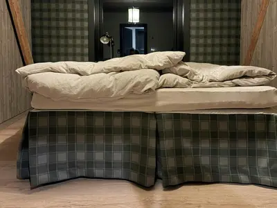 a large bed with two pillows on top of it at Modern Farm With Panoramic Views And Nature in Bjorli