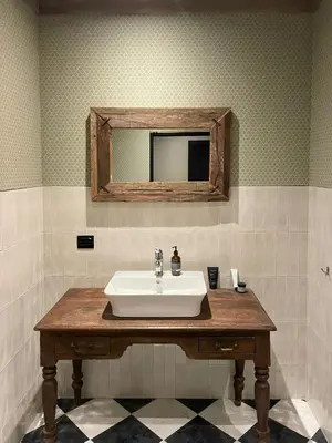 a bathroom with a sink and a mirror on the wall at Modern Farm With Panoramic Views And Nature in Bjorli