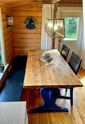 a wooden table in a room with a dining room at Log Cabin With 360-Degree Views Near Trysil in Trysil