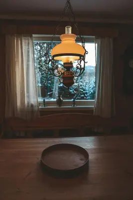 a chandelier hanging over a table in front of a window at Close to cross-country skiing, slalom slope and mountains - Soltun Geilo! in Hol