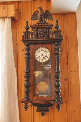 an old grandfather clock hanging on a wall at Close to cross-country skiing, slalom slope and mountains - Soltun Geilo! in Hol