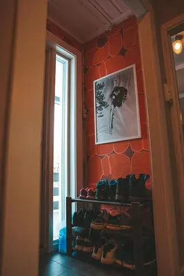 a room with a bunch of shoes on a wall at Close to cross-country skiing, slalom slope and mountains - Soltun Geilo! in Hol