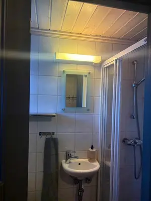 a bathroom with a sink and a mirror at Cozy ski in & out cabin Hemsedal in Hemsedal