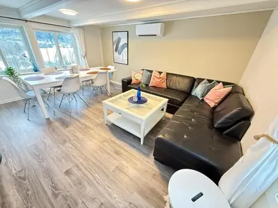 a living room with a couch and a table at Pellan in Surnadal