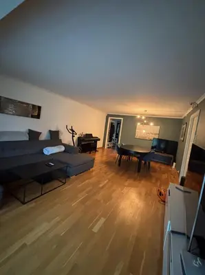 a living room with a couch and a table at Etterstad in Lii