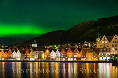 an image of a city with green northern lights at Beautiful apartment in the heart of Bergen in Bergen