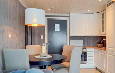 a kitchen and dining room with a table and chairs at 2 Bedroom Lovely Apartment In Rjukan in Rjukan