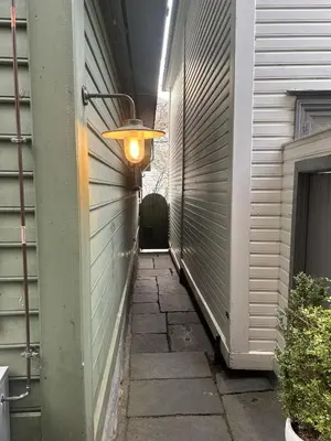 a light on the side of a building at City apartment in Bergen in Bergen