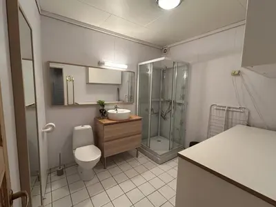 a bathroom with a toilet and a sink and a shower at City apartment in Bergen in Bergen