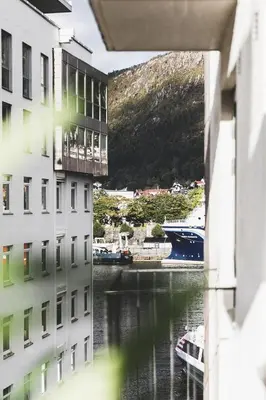 a view of a river between two buildings at Ultra central flat with balcony in Bergen