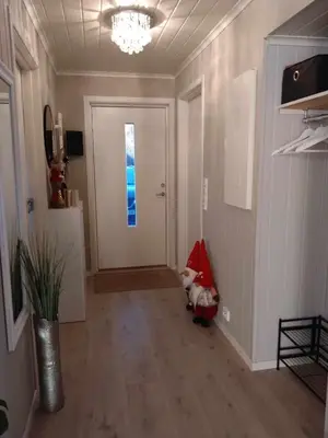 a hallway with a white door and a window at Holiday home near all facilities in Grinde, Aksdal in Tysvær