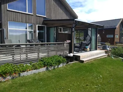 a screened in porch of a house at Holiday home near all facilities in Grinde, Aksdal in Tysvær