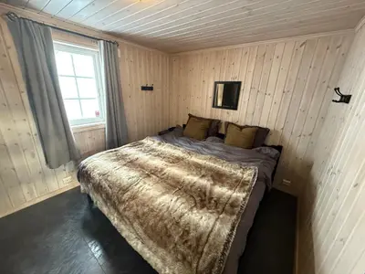 a bedroom with a large bed in a room at Cozy ski in&out cabin Hemsedal in Hemsedal