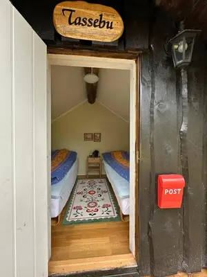 a small room with two beds in a house at Cosy cabin in Eggedal
