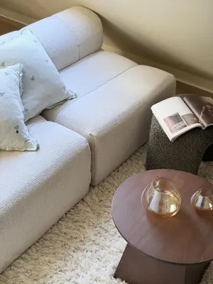 a living room with a bed and a table at Cozy loft apartment in the heart of Bergen in Bergen