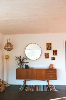 a room with a table and a mirror on the wall at Large house with Ocean view at Ervik and Vestkapp