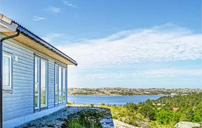 a house with a view of a body of water at Beautiful Home In Fitjar in Fitjar