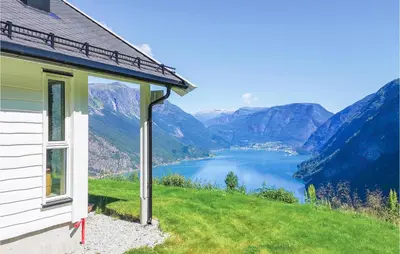 a house on a hill with a view of a lake at 4 Bedroom Stunning Home In Skjolden in Skjolden