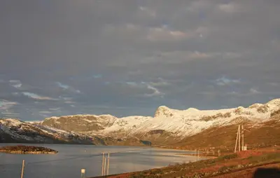a large body of water with snow covered mountains at Holiday Home Hol With A Fireplace 02 in Hovet