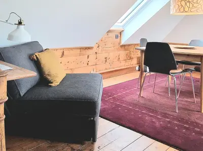 a living room with a couch and a table at Amunds Apartment in Bergen
