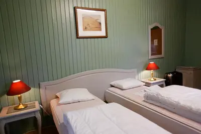 a bedroom with two beds and two lamps on tables at Frya Leir in Frya