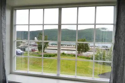 a window with a view of a highway at Villa Haudalan Åndalsnes in Åndalsnes