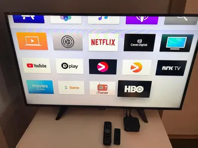 a flat screen tv sitting on top of a table at Kvamseter Lodge in Kvamseter